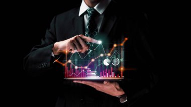 Businessman analyst working with digital finance business data graph showing technology of investment strategy for perceptive financial business decision. Digital economic analysis technology concept.