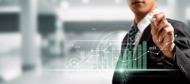Businessman analyst working with digital finance business data graph showing technology of investment strategy for perceptive financial business decision. Digital economic analysis technology concept.