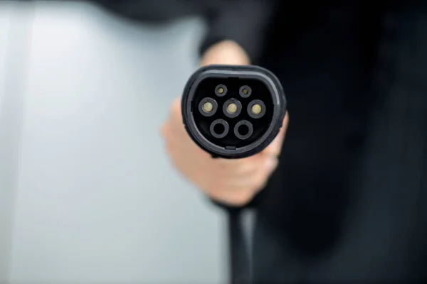 Focus Closeup Hand Holding Plug Electric Vehicle Pointing Camera Charging — Fotografia de Stock