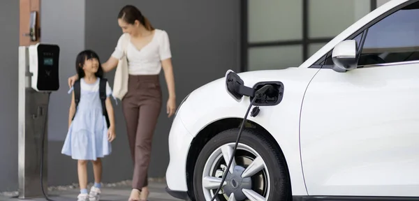 Focus Car Recharging Home Charging Station Blurred Progressive Woman Young — Photo