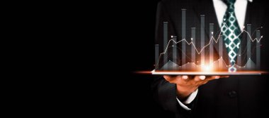 Businessman analyst working with digital finance business data graph showing technology of investment strategy for perceptive financial business decision. Digital economic analysis technology concept.