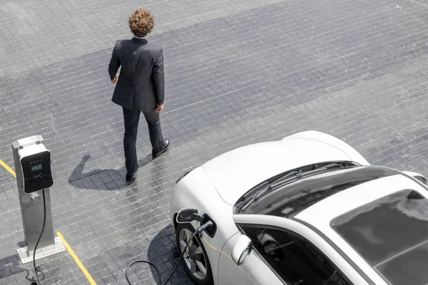 Aerial View Progressive Businessman Black Formal Suit His Electric Vehicle — Stok fotoğraf
