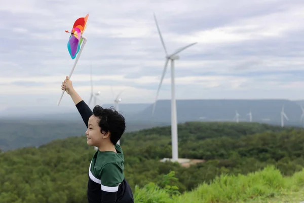 Progressive Young Asian Boy Playing Wind Pinwheel Toy Wind Turbine — Foto Stock
