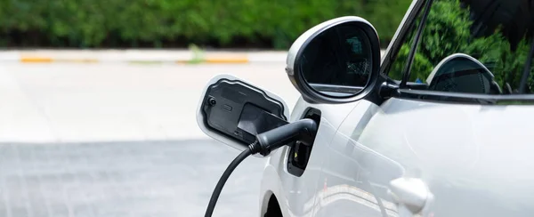 Closeup Electric Vehicle Plugged Charger Public Charging Station Powered Renewable — Stok fotoğraf