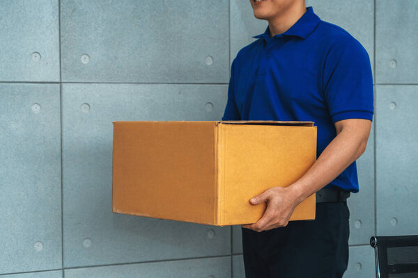 Delivery person carrying parcel box to send to customer . Delivery business concept . Jivy