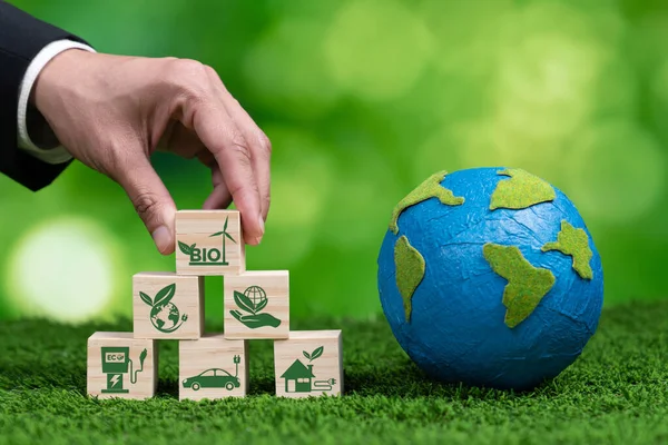 Hand Businessman Holding Earth Symbolizing Green Business Utilizing Biofuel Technology — Stock Photo, Image