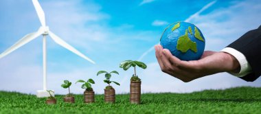 Çevre koruma üzerine çevre yatırımları sübvanse edilir, tohum yetiştirme madeni para yığını, el ele tutuşan kağıt Dünya ve rüzgar türbini. Temiz ve yenilenebilir enerji ile sürdürülebilir finansal büyüme. Değiştir