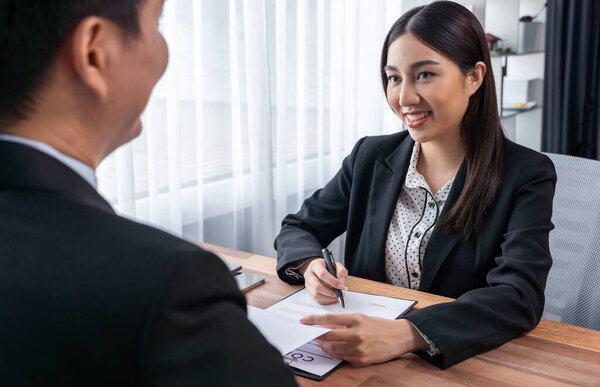 Businessman review agreement document before signing contract. Reading carefully to ensure trade deal align with business goals. Professionalism for business decision making concept. Jubilant