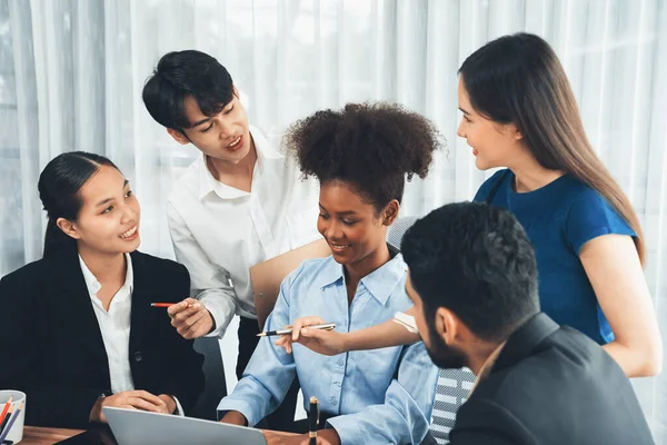 stock image Happy diverse business people work together, discussing in corporate office. Professional and diversity teamwork discuss business plan on desk with laptop. Modern multicultural office worker. Concord