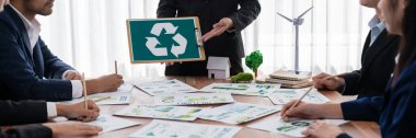 Group of business people planning and discussing on recycle reduce reuse policy symbol in office meeting room. Green business company with eco-friendly waste management regulation concept.Trailblazing clipart