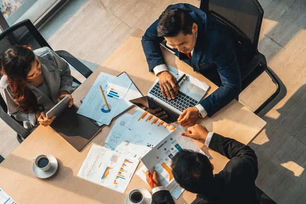 stock image Business people group meeting shot from top view in office . Profession businesswomen, businessmen and office workers working in team conference with project planning document on meeting table . Jivy