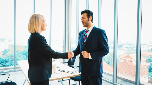 stock image Business people handshake in corporate office showing professional agreement on a financial deal contract. Jivy