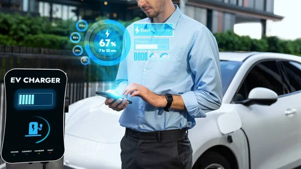 Businessman Checking Battery Status Hologram Smartphone Application While His Car — Stock Photo, Image