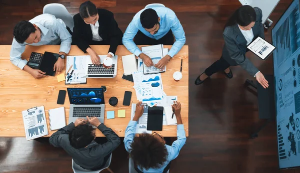 Stock image Top view business presentation with data analysis dashboard on TV screen in modern meeting room. Business people brainstorming or working together to plan business marketing strategy. Concord