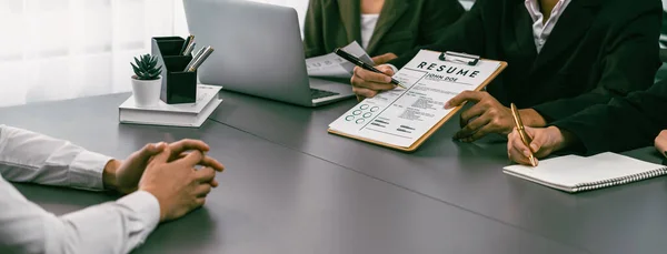 stock image Candidate and interviewers discuss work experience and qualifications in friendly job interview at corporate office. HR team evaluates job application while interviewee explaining profile. Prodigy