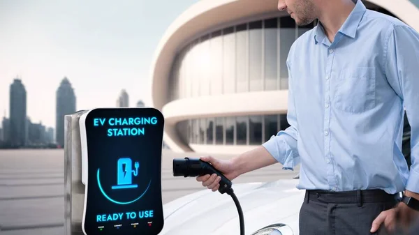 Businessman Pull Hold Charger Plug Form Electric Car Charging Station — Stock Photo, Image