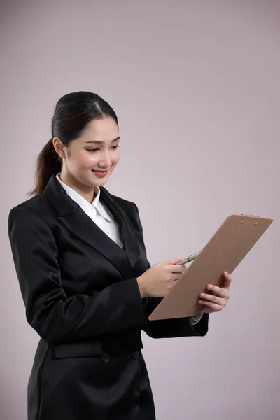 Confident Young Businesswoman Stands Isolated Background Holding Clipboard Posing Formal — Stock Photo, Image