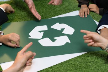 Recycle icon on meeting table in office with business people planning eco business investment on waste management as recycle reduce reuse concept for clean ecosystem. Quaint clipart