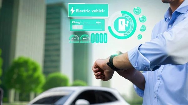 Businessman Check Car Battery Status Smartwatch Hologram Recharge Charging Station — Stock Photo, Image