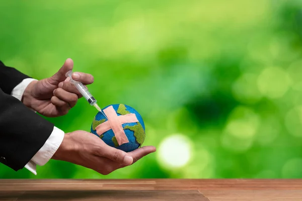 Businessman Holds Inject Medicine Paper Earth Symbol Eco Environmental Awareness — Stock Photo, Image
