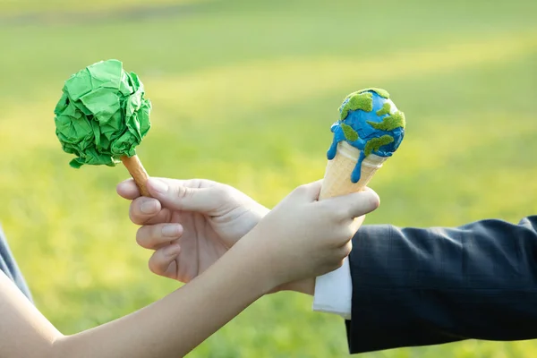 Businessman exchange tree to a boy holding melting Earth as part of ESG and CSR initiative concept of corporate responsibility for greener environment and sustainable future generation. Gyre