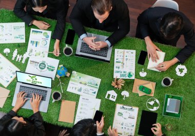 Panorama top view of business people planning business marketing with environmental responsibility for greener ecology. Productive teamwork contribute nature preservation and sustainable future.Quaint clipart