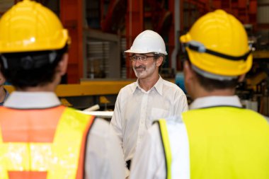 Collective factory worker and engineer gather for meeting with factory executive or manager, discussing plan and industry training program on-site work heavy industrial steel workshop. Exemplifying clipart