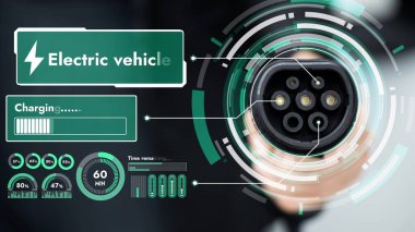 Kameranın önündeki EV şarj aletine odaklan. Görünmez iş adamı geçmişine sahip akıllı dijital batarya durum hologramını göster. Alternatif temiz enerji kullanan EV araba şarjı CO2 salınımını azaltıyor. İnceleyin