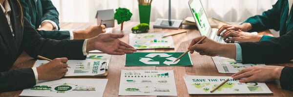 Group of business people planning and discussing on recycle reduce reuse policy symbol in office meeting room. Green business company with eco-friendly waste management regulation concept.Trailblazing