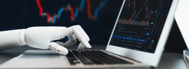 Otomatik borsa konsepti. Borsadaki finansal verileri analiz eden robot el, borsadaki fiyat değişikliğini tahmin etmek için yapay zeka kullanımı. Önde.