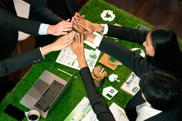 Green business community celebrate by happy business people high five after made successful environmental plan and integration of eco-regulation in corporate. Quaint