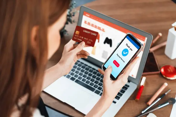Woman shopping online on internet marketplace browsing for sale items for modern lifestyle and use credit card for online payment from wallet protected by utmost cyber security software
