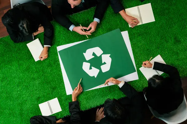 Top view panorama banner recycle icon on meeting table in office with business people planning eco business investment on waste management as recycle reduce reuse concept for clean ecosystem. Quaint