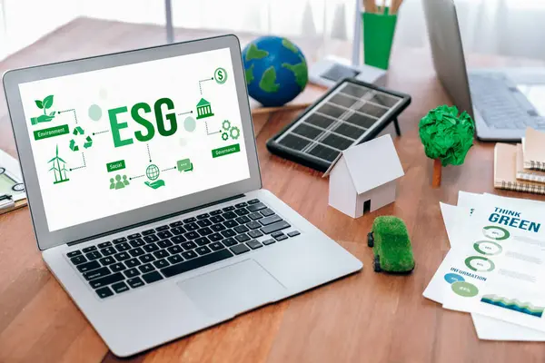 Green business company office with eco-friendly and environment conservation policy, office table with eco mockup and laptop display ESG as environmental social governance concept. Trailblazing
