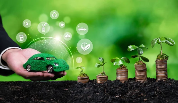 Growing money or coin stack with business investor invest in net zero electric car using sustainable and alternative energy. Electric vehicle and automobile market growth from eco investment. Reliance