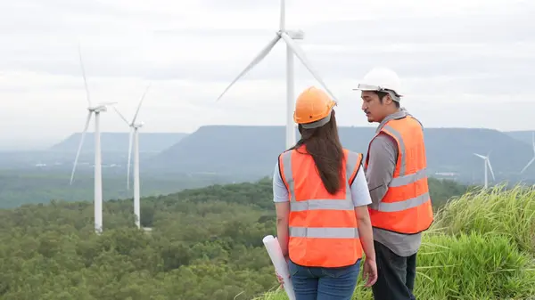 Male Female Engineers Working Wind Farm Atop Hill Mountain Rural — Stock Photo, Image
