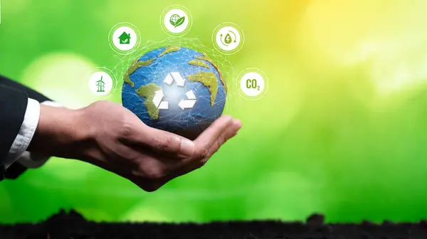 Businessperson holding and protecting Earth with recycle symbol. Business commitment to sustainable environmental protection and waste recycling practice for cleaner ecosystem. Panorama Reliance
