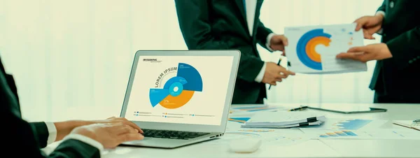 Business data dashboard analysis by computer software . Investment application display business sales and profit on the computer screen and advise marketing planning decision oratory .