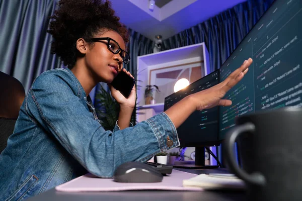 stock image Young African American IT developer concentrating on monitor screen laptop with codding program in data of application and website, Concept of creating innovative html updated version. Tastemaker.