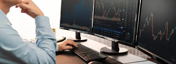 Stock trading investor monitoring dynamic financial data graph for profitable trade. Businessman or broker with analytic thinking analyzing data for stock market exchange trading company. Trailblazing