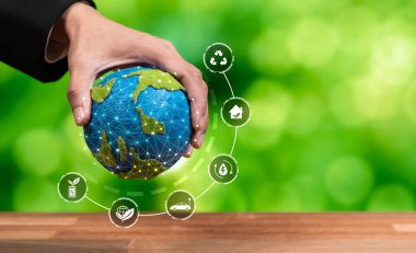 Dünya 'yı çevreci ikon tasarımı ile tutan iş adamı, dünya ekosistemini net sıfır teknolojisi ve ESG uygulaması ile korumaya yönelik iş dünyasının bağlılığını sembolize ediyor. Boşluk