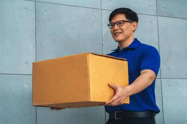 Delivery person carrying parcel box to send to customer . Delivery business concept . Jivy