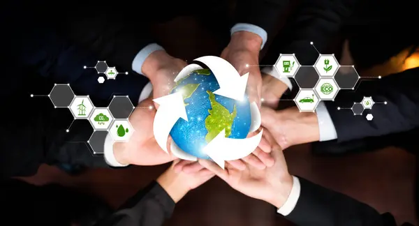 Business partnership holding Earth globe together with recycle icon symbolize ESG sustainable environment and ecosystem protection with eco recycling technology and waste reduction. Reliance