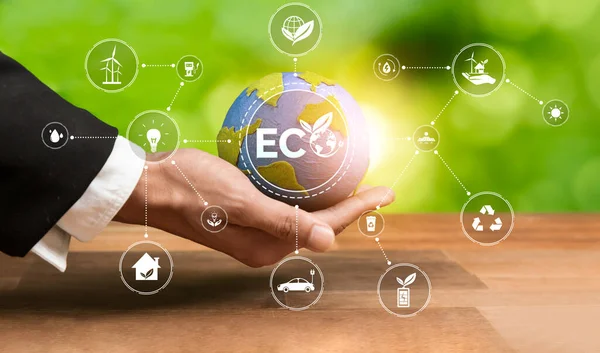 Businessmans hand holding Earth globe symbolize corporate commitment to ESG to reduce carbon emission, adopt eco friendly clean business to minimize environmental impact for net zero world. Reliance