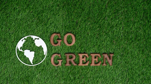 Go green and save the world with environment friendly effort. The message Go Green letters arranged to promote eco awareness for sustainable future with biophilc design background. Gyre