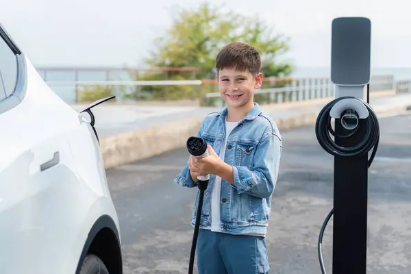 Playful Little Boy Pointing Charger Camera Recharging Eco Friendly Electric — Stock Photo, Image
