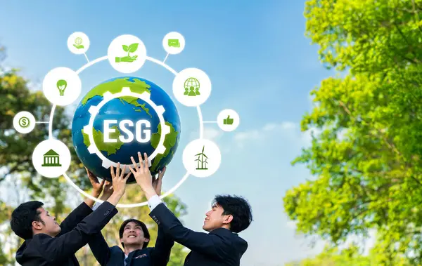 Group of business people promote environment awareness, holding big Earth ball with eco friendly icon symbolize ESG business commitment to environmental protection and sustainable net zero. Reliance