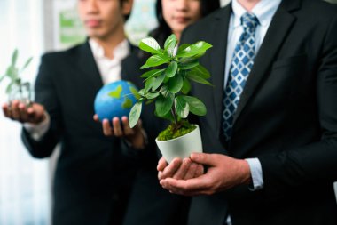 Business people promoting environmental campaign to reduce CO2 emission and save Earth from global warming using renewable clean energy and reforestation for sustainable and greener future. Quaint clipart