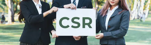 Group of business people stand, holding eco-friendly idea and concept for environmental awareness campaign on corporate social responsible to protect environment and nature with CSR principle. Gyre