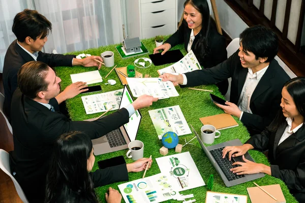 Diverse group of business people planning business marketing with environmental responsibility for greener ecology. Productive teamwork contribute natural preservation and sustainable future. Quaint